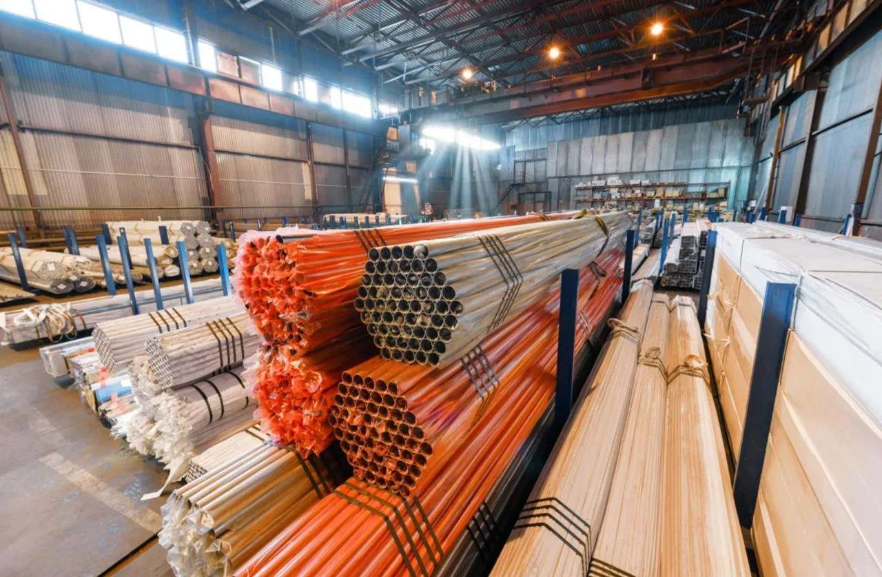 Stacked steel tubes in a warehouse